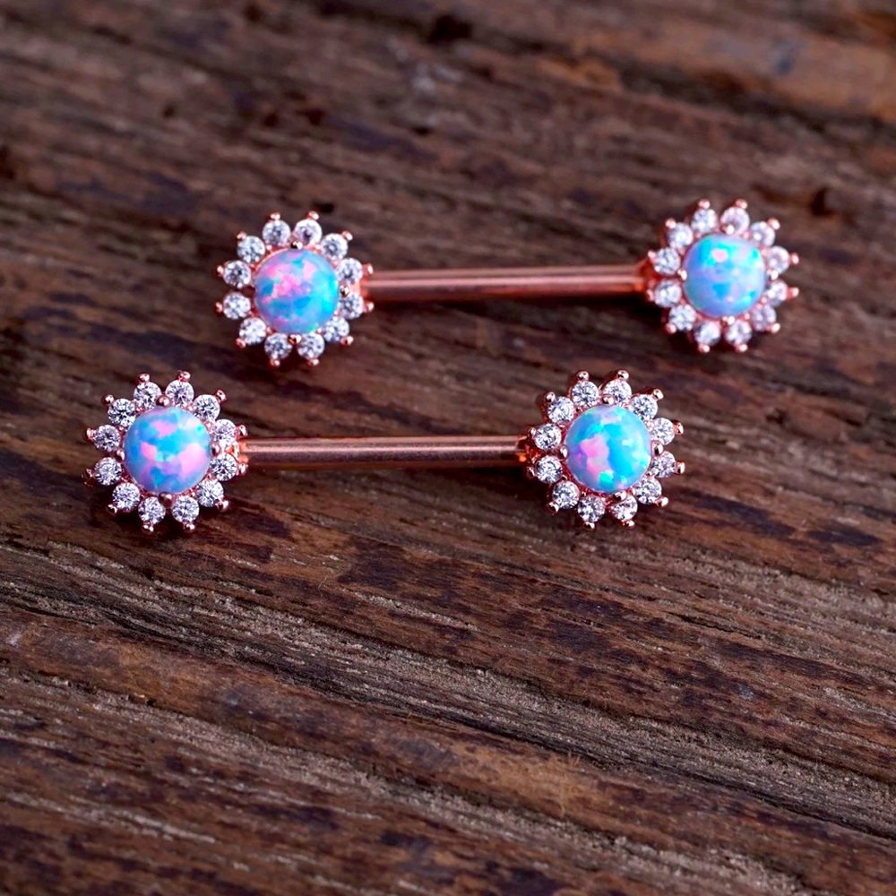 Beautiful Cotton candy opal gem with surrounding diamonds and a copper gold bar